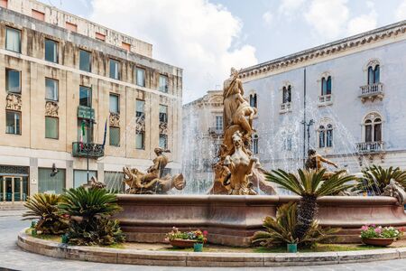 SYRAKUSE, SICILY, ITALY - April 26, 2017: Famous Artemis (Diana) Fountain on Archimedes Square on the Ortygia isle - old town of Syracuse on Sicily island, Italyのeditorial素材