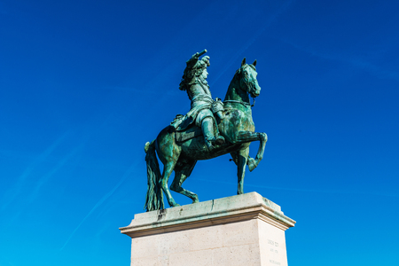 PARIS, FRANCE - November 2017: King Louis XIV statue in front of Palace of Versailles, Franceのeditorial素材