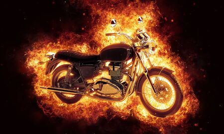 Dramatic fine art of a burning motorcycle engulfed in fiery orange hot flames and shooting sparks over a dark backgroundの写真素材