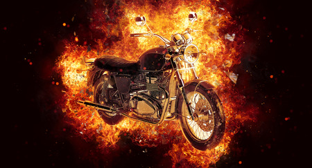 Dramatic burning motorcycle engulfed in fierce fiery orange flames and exploding sparks on a dark background, 3d renderingの写真素材