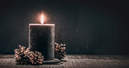 burning candle on a black background.の写真素材