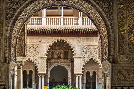 SEVILLE, SPAIN - December 09 2019: View through an arch of Patio de las Doncellas or Hall of the Maidens in the Real Alcazar, Seville, Spain, a UNESCO World Heritage Siteのeditorial素材