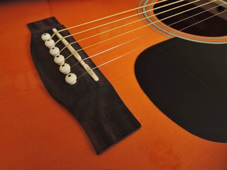 Guitar part closeup. Stringed musical instrument.