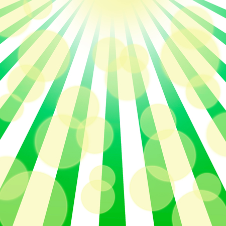 Radiant spring green background with yellow bokeh sunbeams.の写真素材