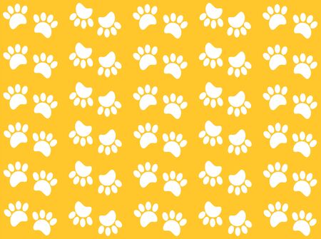 White paw prints pattern on a yellow background.の写真素材