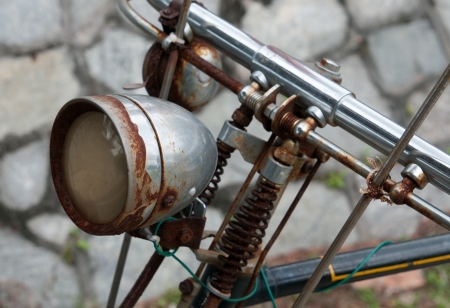 rusty old bike lampの写真素材