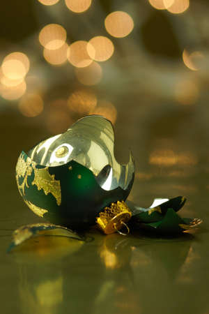 Broken Green and Gold Holiday ornamentの写真素材