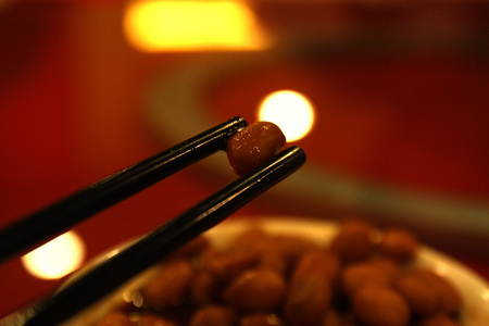 a pair of chopstick pick on a peanut, chinese food cuisine cultureの写真素材