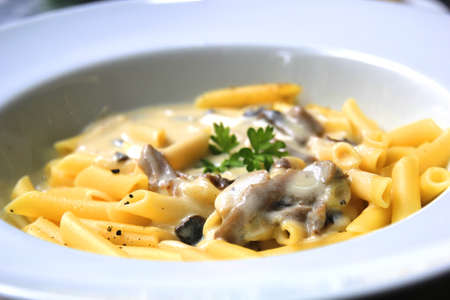 pasta with mushroom cream meat sauce delicious dinnerの写真素材