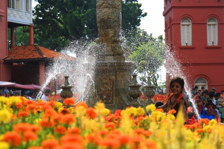 an indian girl playing around the Queen Victoria s Fountain at Melaka red houseのeditorial素材
