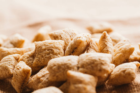 cereal pillows with chocolate filling on sackcloth background.の写真素材