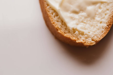 sandwich with creamy melted cheese close-up on a light background.の写真素材