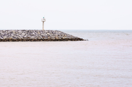 Small lighthouse at the end of coast of Rayongの写真素材