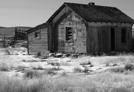 An long abandoned homestead in rural Central Oregon shows its wear from the elements on a winter day.の写真素材