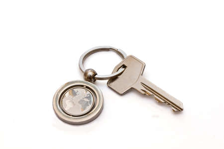 key with the key ring, which shows the map of the worldの写真素材