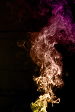 colorful smoke on black backgroundの写真素材