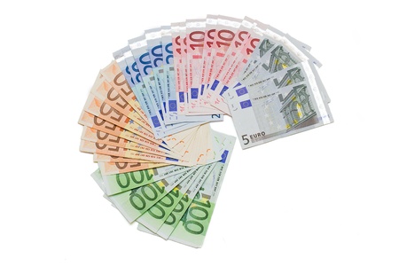 euro banknotes spread out on a white background