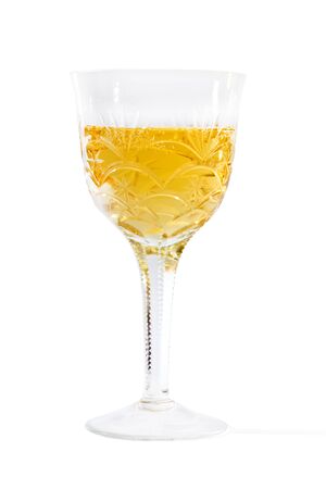 crystal glass with champagne on a white backgroundの写真素材
