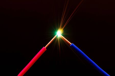 bright flash of short-circuit and flying sparksの写真素材