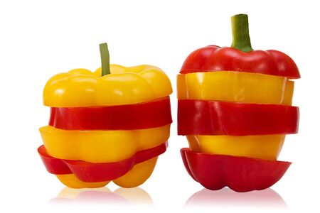 sliced red and yellow bell pepper on white backgroundの写真素材