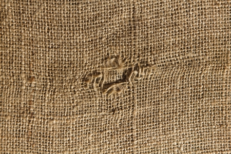 texture old sack with a hole in the middleの写真素材