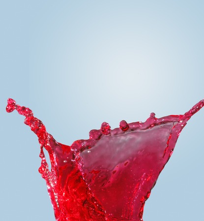 splash of water on a gradient blue backgroundの写真素材