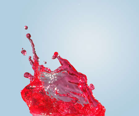 splash of water on a gradient blue backgroundの写真素材