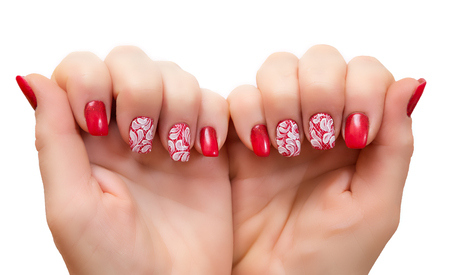 Female hands with manicure on a white backgroundの写真素材
