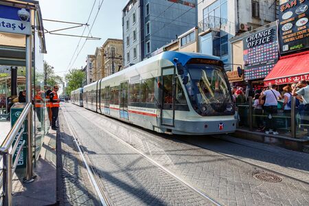 modern high-speed tram on narrow street Istanbulの写真素材