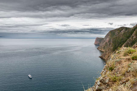 Lake Baikal in cloudy weather. The rocks.の写真素材
