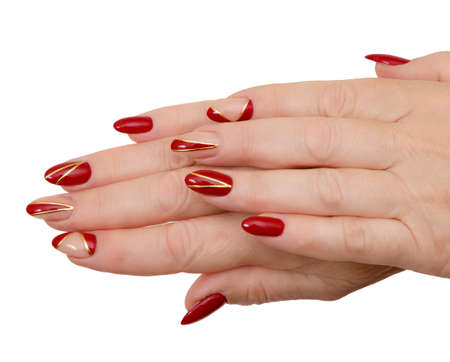 Female hands with a multicolored manicure closeupの写真素材