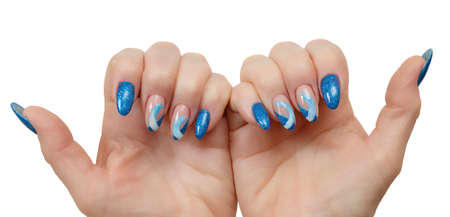 Female hands with a multicolored manicure closeupの写真素材