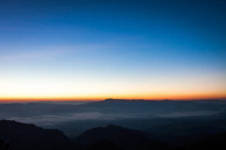 Sun rise with blue and orange sky in the morningの写真素材