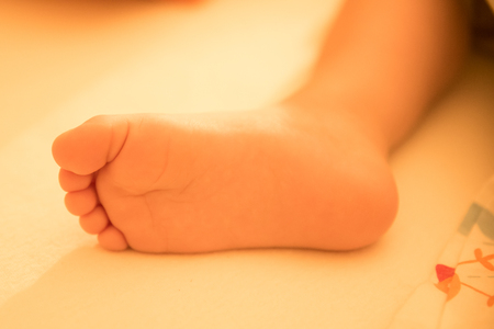 Foot of sleeping childの写真素材