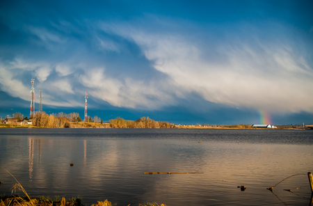 Passing Rain Storm on a calm lake Calgary Albertaの写真素材
