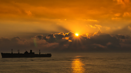silhouette of the ancient ship at sunset, closeupの写真素材