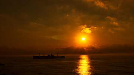 silhouette of the ancient ship at sunset, closeupの写真素材