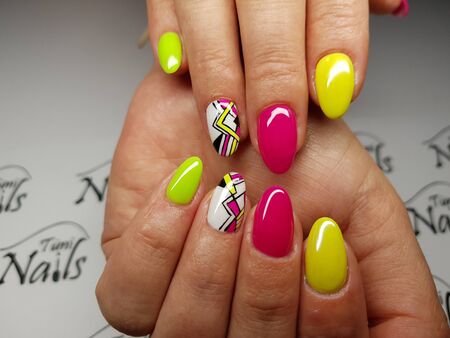 Beautiful colorful nails and hand manicure.のeditorial素材