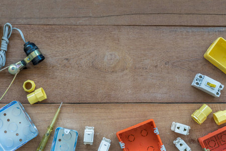 Electrical Tools for Construction on Wooden Background with Copyspaceの写真素材