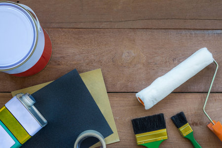 Top View of Construction Painting Tools on Wooden Background with Copy Spaceの写真素材