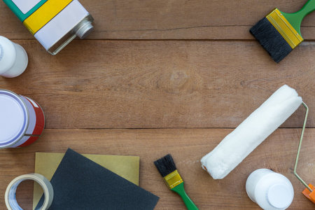 Top View of Construction Painting Tools on Wooden Background with Copy Spaceの写真素材