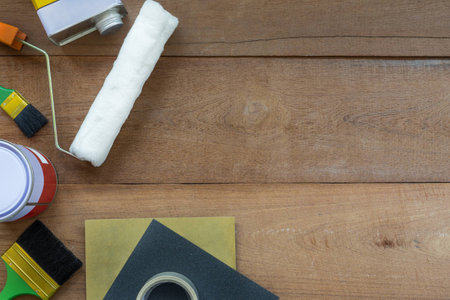 Top View of Construction Painting Tools on Wooden Background with Copy Spaceの写真素材