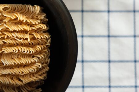 Instant Noodle in a bowl on a tableの写真素材