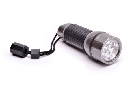 Small pocket flashlight at white backgroundの写真素材