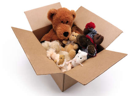 Fluffy toys in a cardboard box