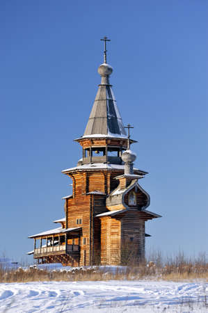 Small wooden church, winter, clear sky at backgroundの写真素材