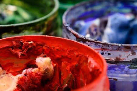 Goup of opened cans with multicolored paintsの写真素材