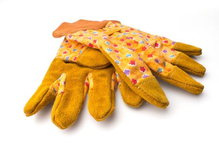 Gardening: pair of yellow gardeners protective gloves, isolated on white background