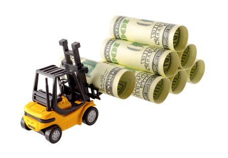 Isolated objects: financial concept, yellow forklift stacking up one-hundred dollar bills, rolled as tubes, isolated on white background.の写真素材