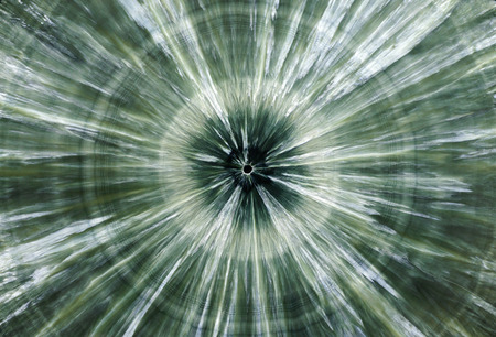 Backgrounds and textures: surface of beautiful green decorative stone, Clinochlore, abstract pattern of concentric circles and radial cracks, spots and stains, natural backgroundの写真素材